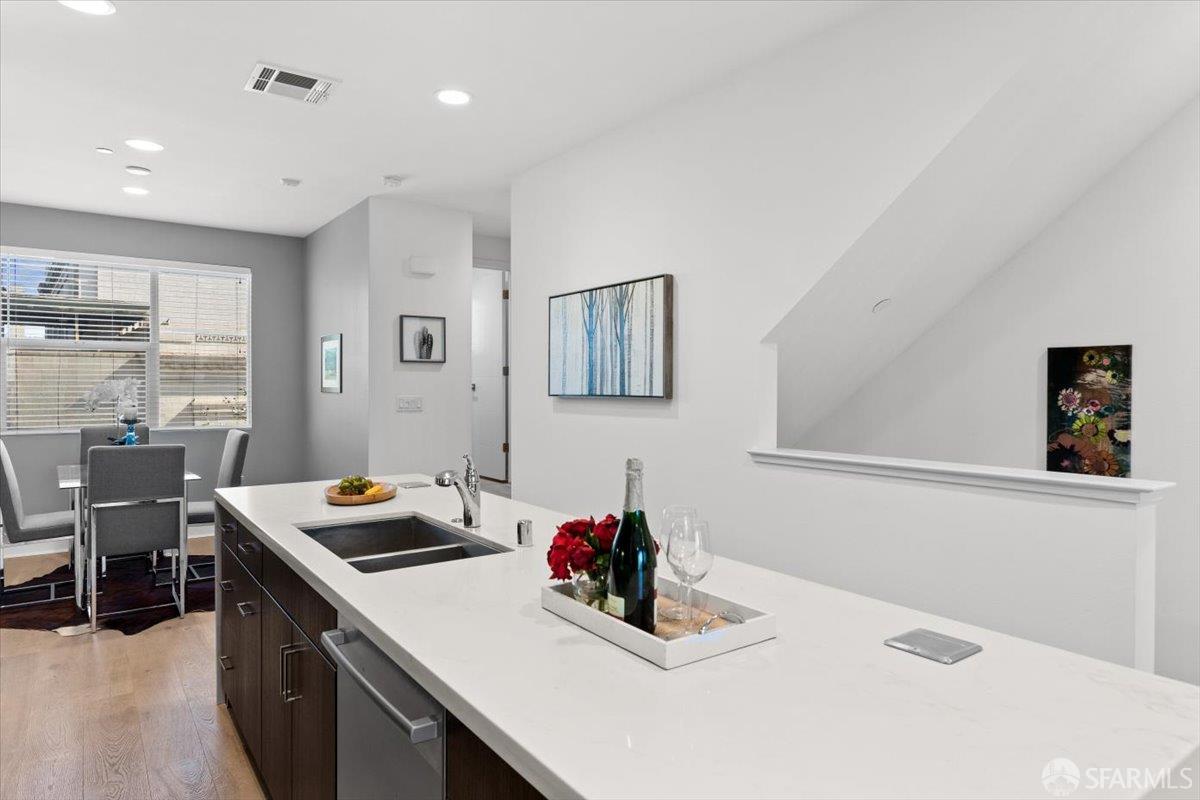 1807 16th Street Oakland, CA 94607 - Photo 8 of 45 a kitchen that has a stove and a table