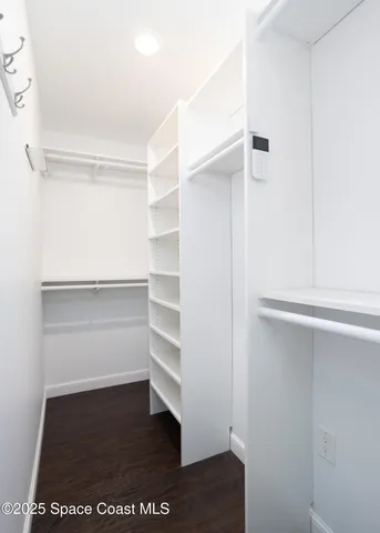 a bathroom with a granite countertop sink toilet a mirror and a shower