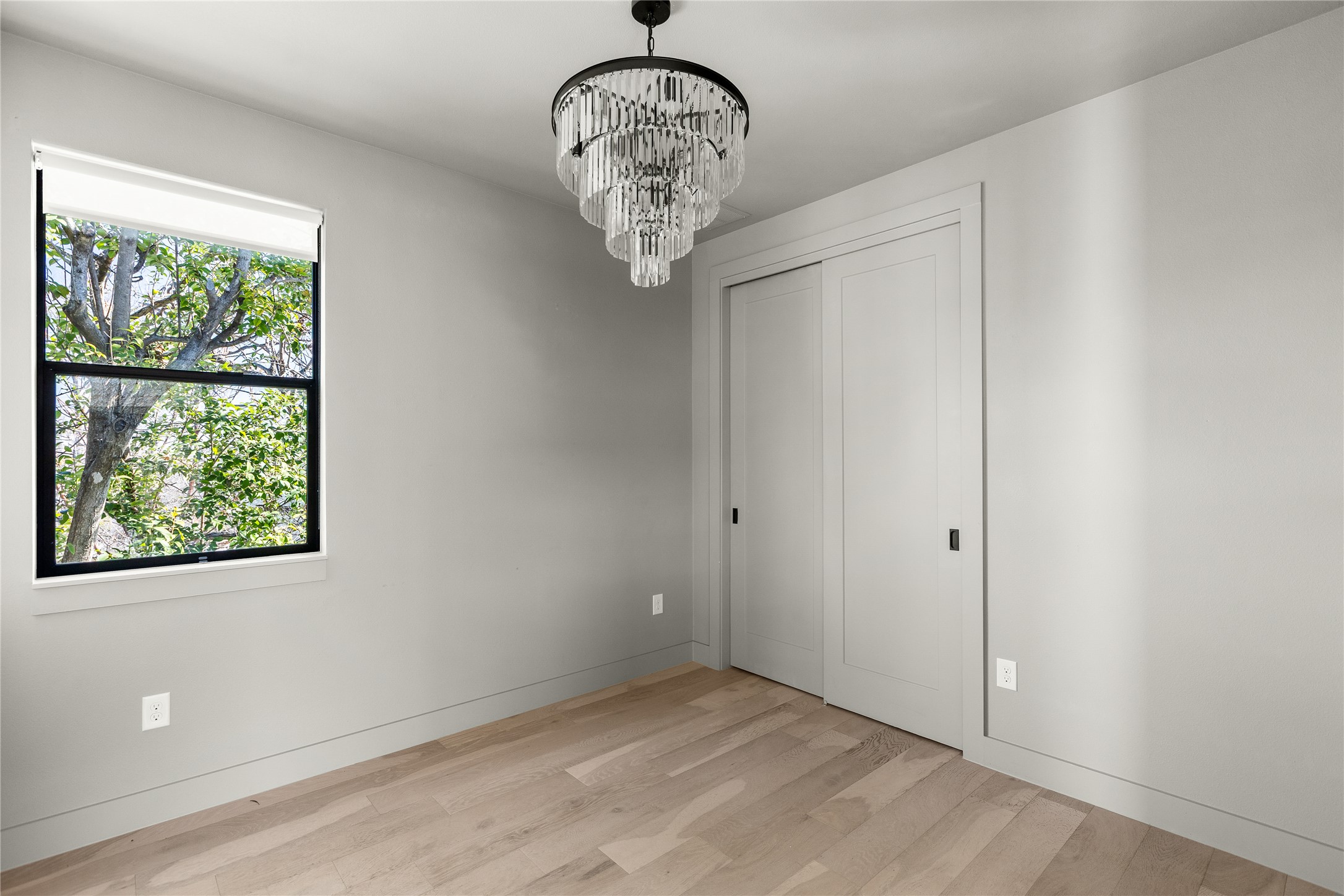 2804 East 22nd Street, Unit B Austin, TX 78722 - Photo 14 of 40 a view of a chandelier fan and window