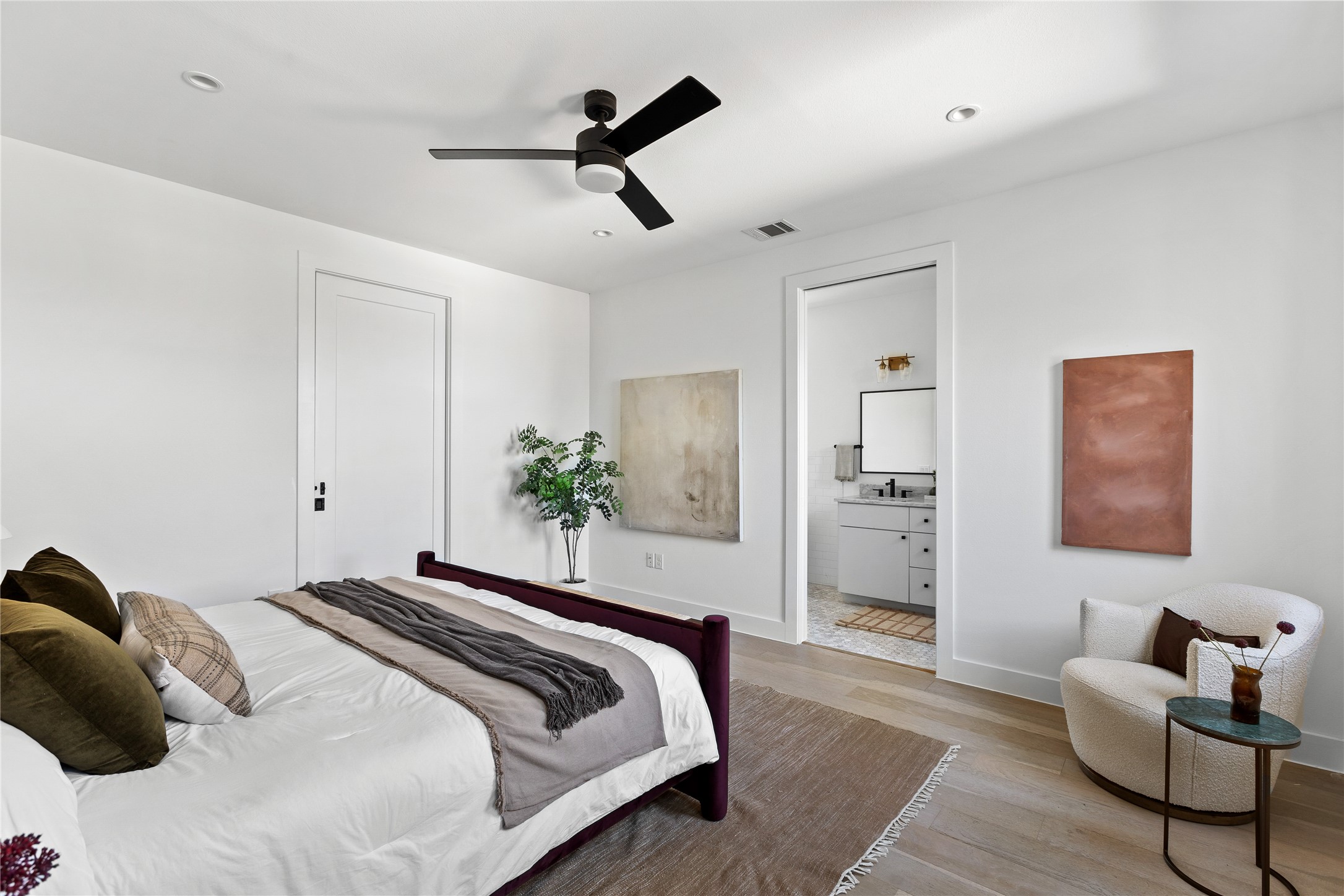 2804 East 22nd Street, Unit B Austin, TX 78722 - Photo 8 of 40 a bedroom with a bed and furniture