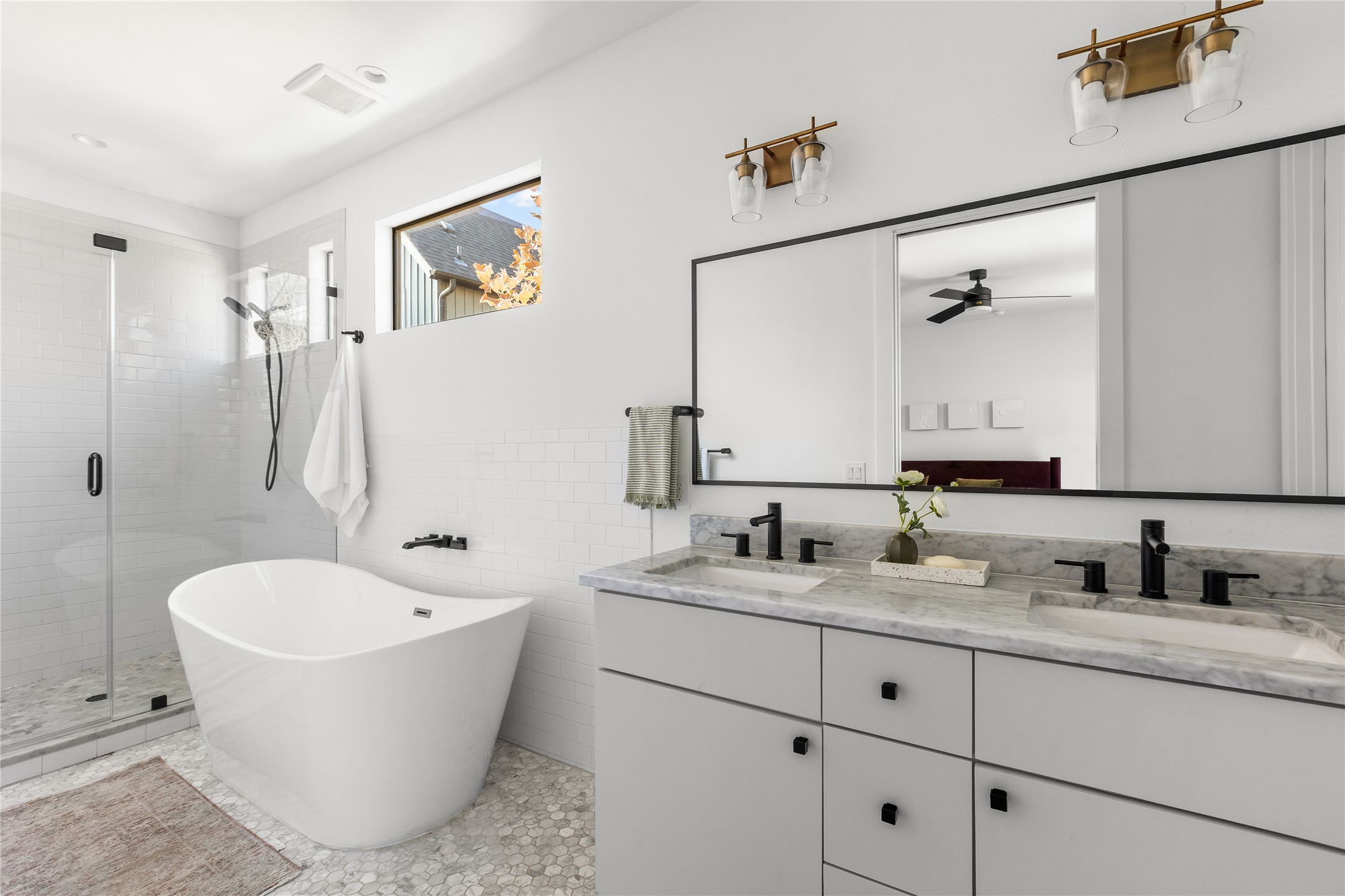 2804 East 22nd Street, Unit B Austin, TX 78722 - Photo 9 of 40 a bathroom with a granite countertop tub sink and mirror