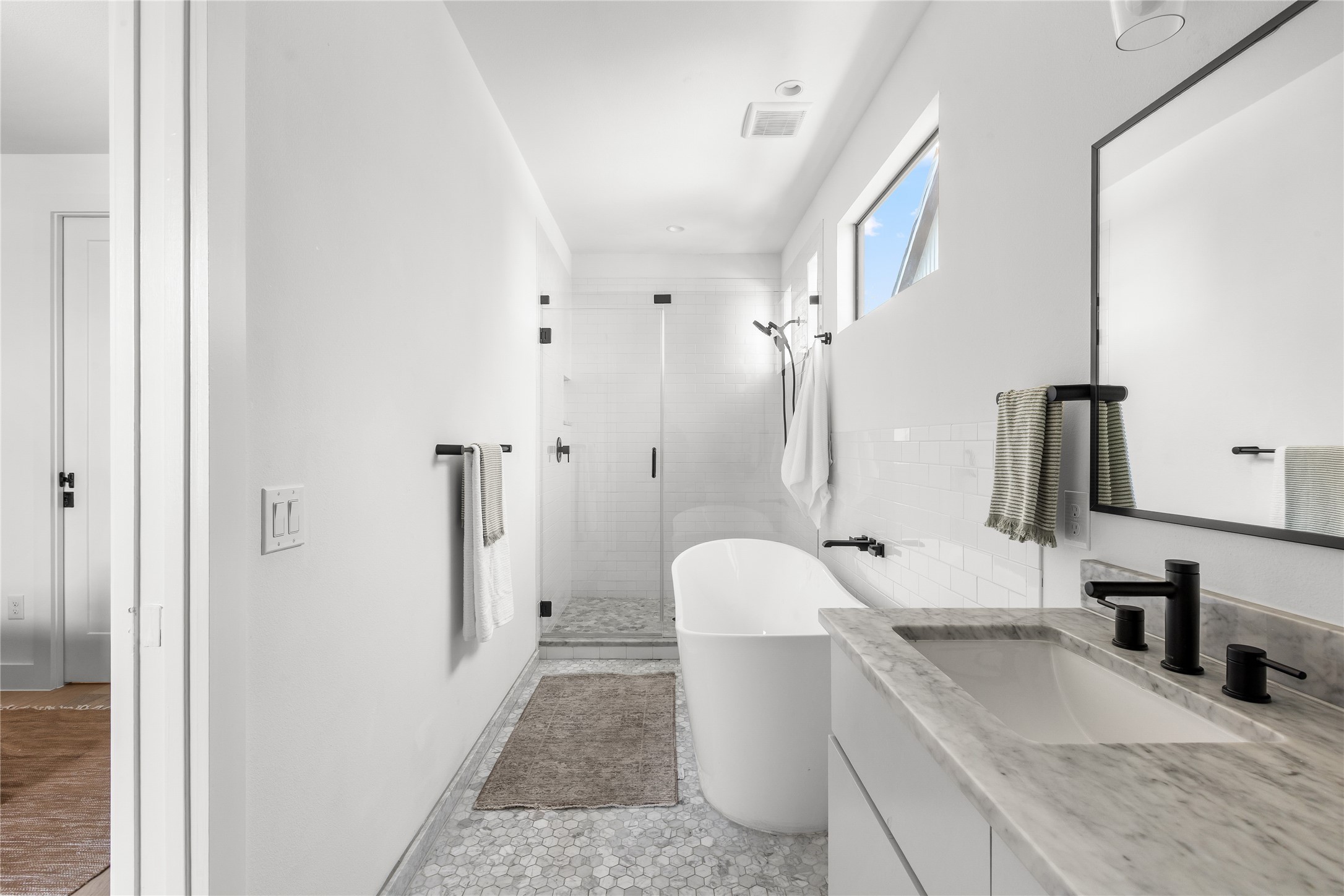 2804 East 22nd Street, Unit B Austin, TX 78722 - Photo 10 of 40 a bathroom with a granite countertop sink a toilet and shower