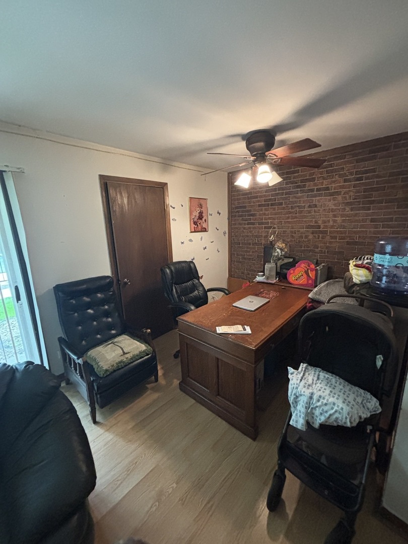 1050 Holbrook Road, Unit 1H Homewood, IL 60430 - Photo 6 of 10 a bedroom with a bed and wooden floor