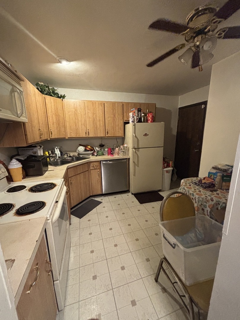 1050 Holbrook Road, Unit 1H Homewood, IL 60430 - Photo 8 of 10 a kitchen with a sink appliances and cabinets