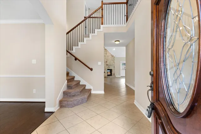 a view of entryway with wooden floor and stairs
