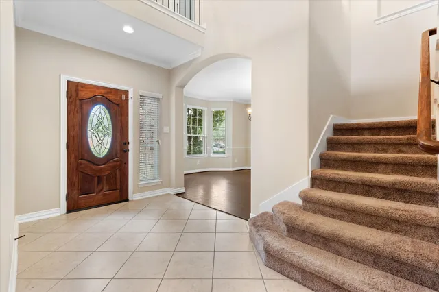 a view of an entryway with wooden floor