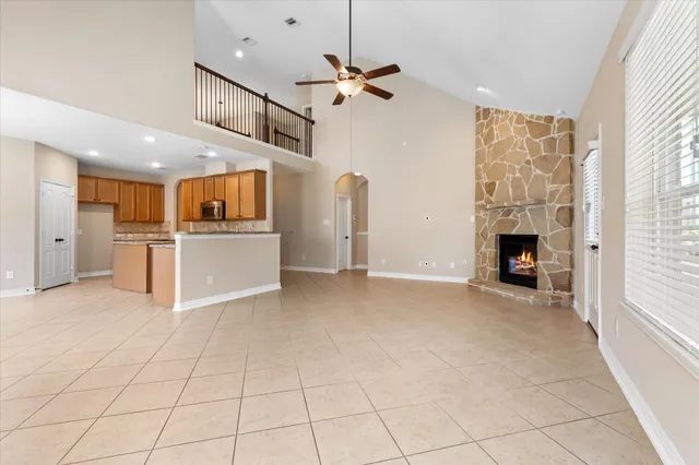 a view of a kitchen with a sink and a fireplace