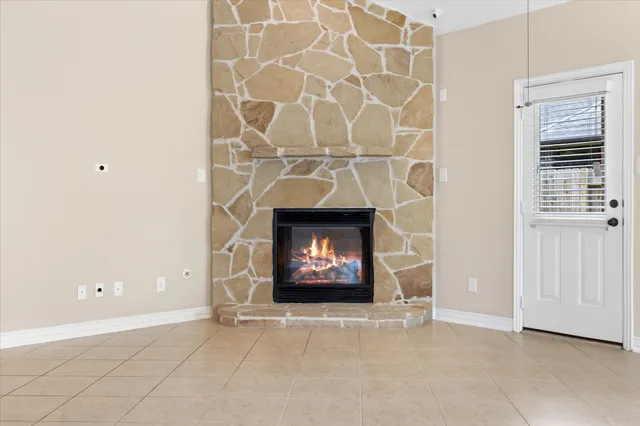 a view of an empty room with a fireplace