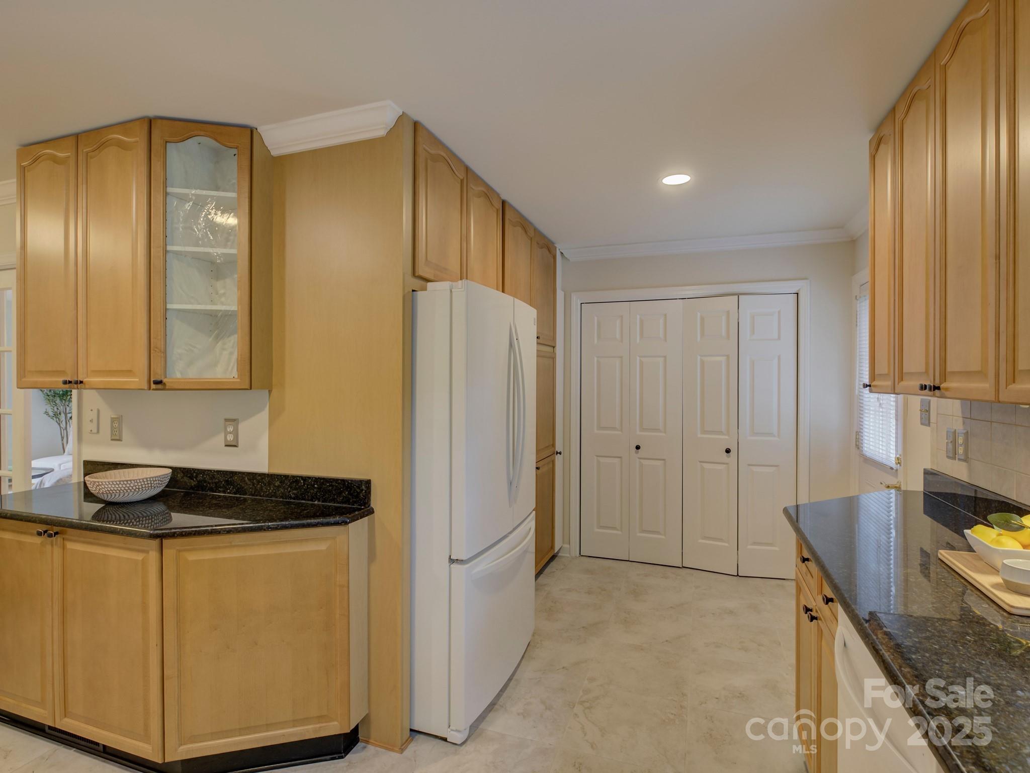 1340 Braeburn Road Charlotte, NC 28211 - Photo 14 of 46 a kitchen with a refrigerator and a stove