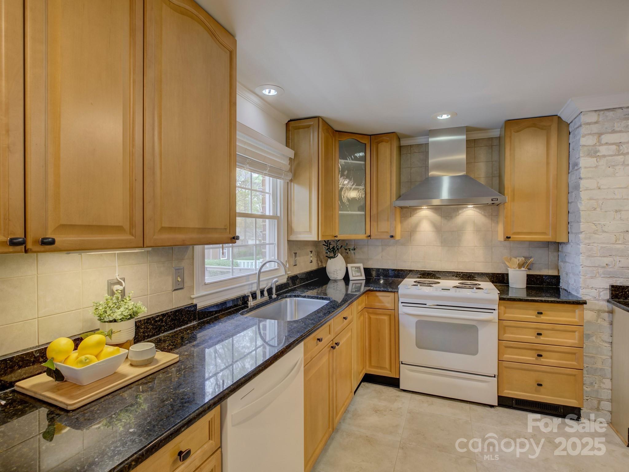 1340 Braeburn Road Charlotte, NC 28211 - Photo 15 of 46 a kitchen with appliances a sink and cabinets