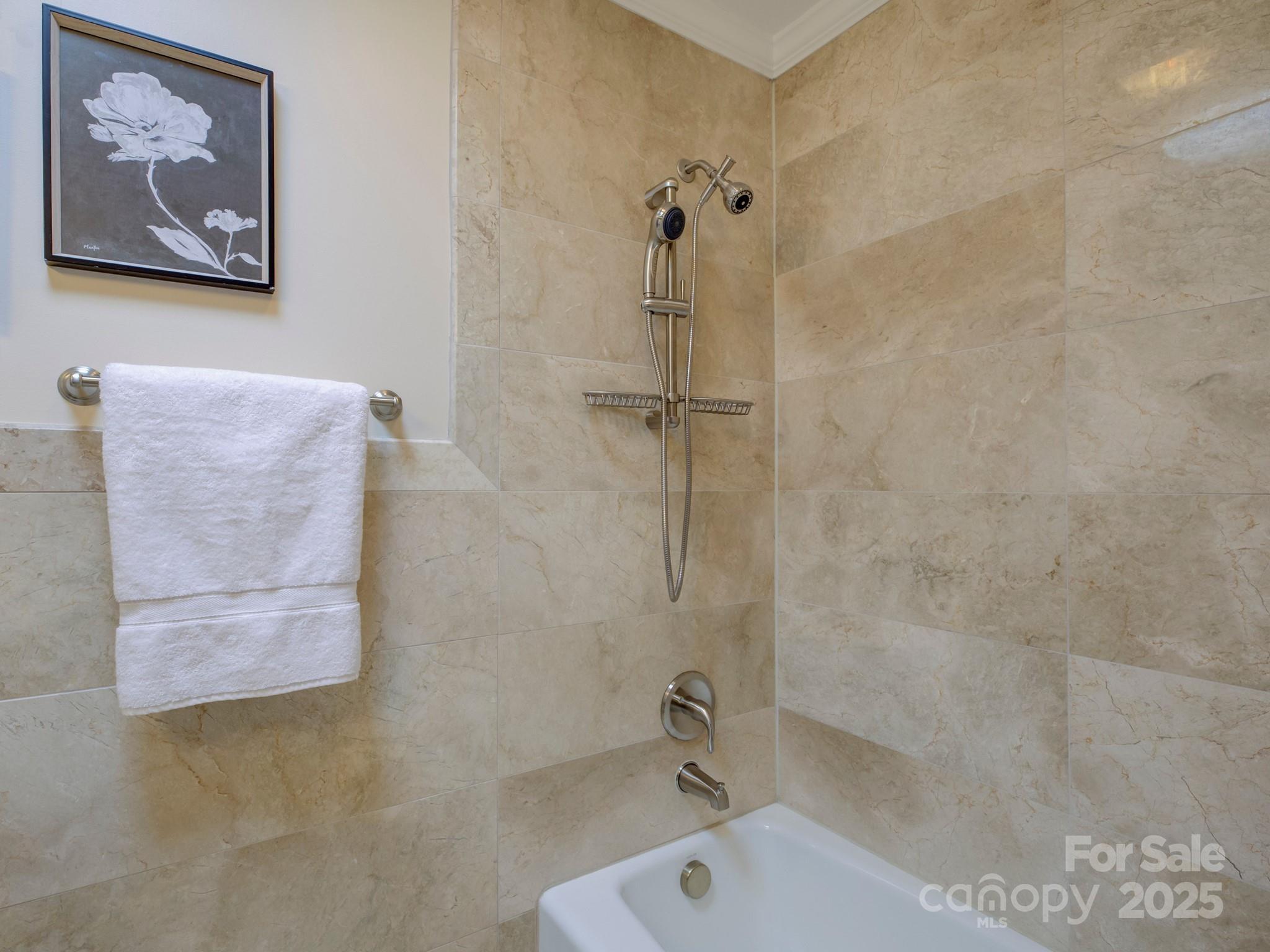 1340 Braeburn Road Charlotte, NC 28211 - Photo 26 of 46 a bathroom with a tub and a shower