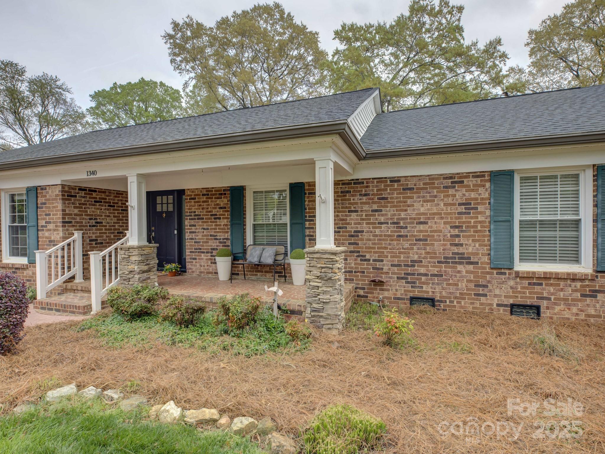 1340 Braeburn Road Charlotte, NC 28211 - Photo 3 of 46 a front view of a house with garden