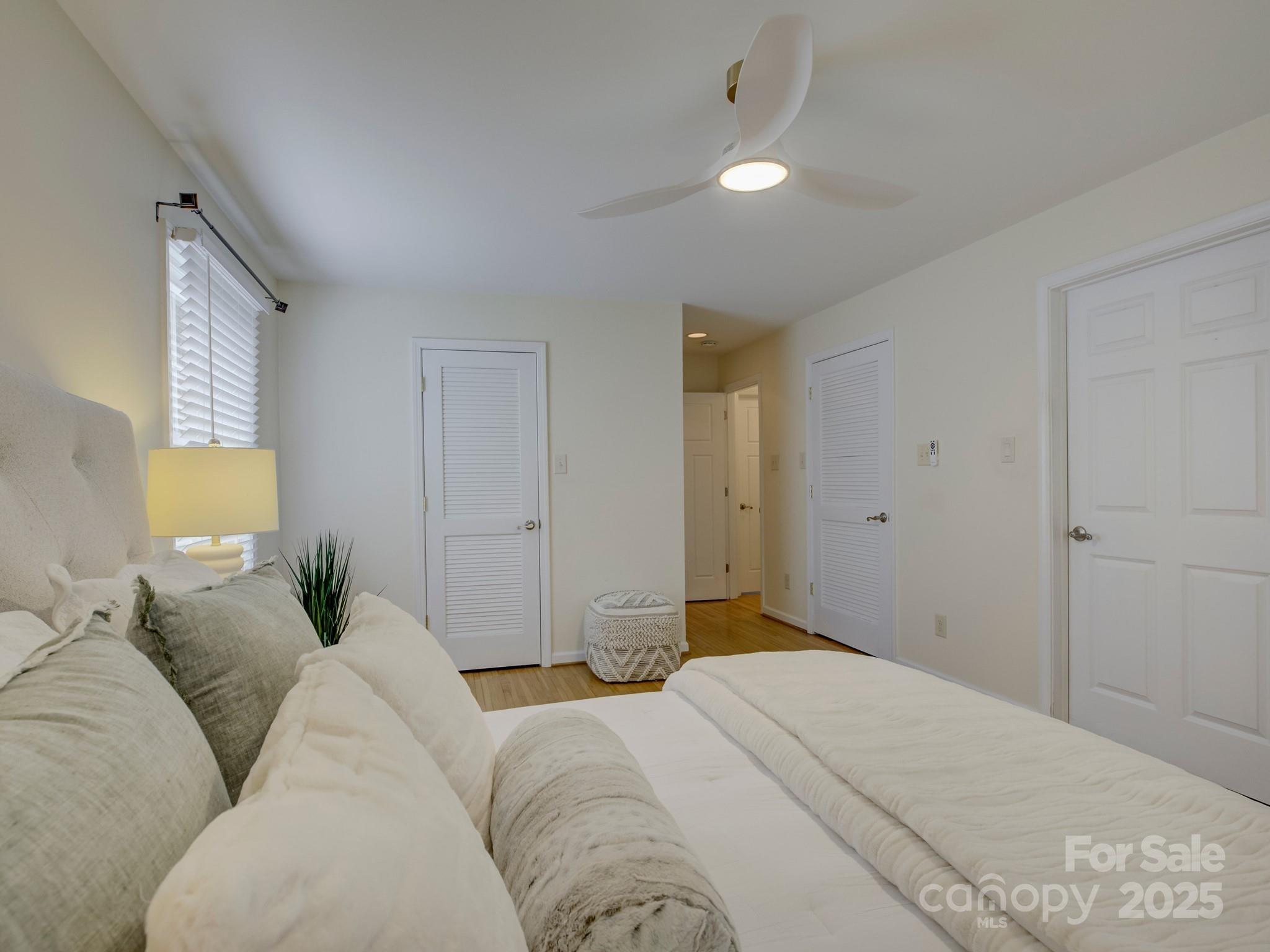 1340 Braeburn Road Charlotte, NC 28211 - Photo 31 of 46 a bedroom with a bed and a couch