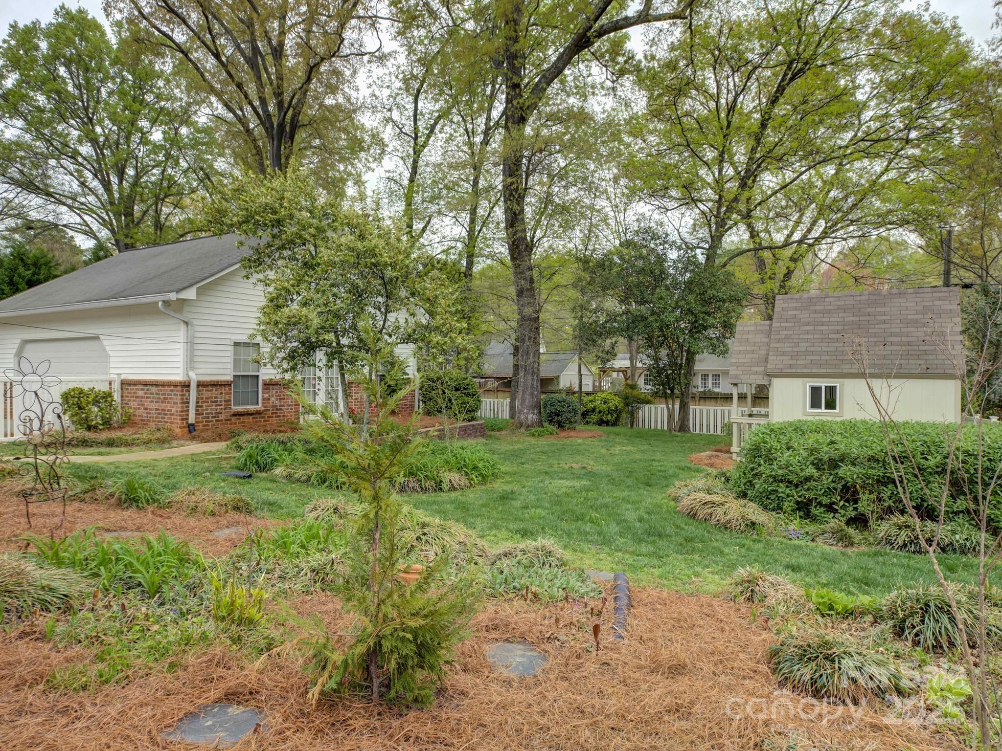 1340 Braeburn Road Charlotte, NC 28211 - Photo 38 of 46 a view of a house with a back yard