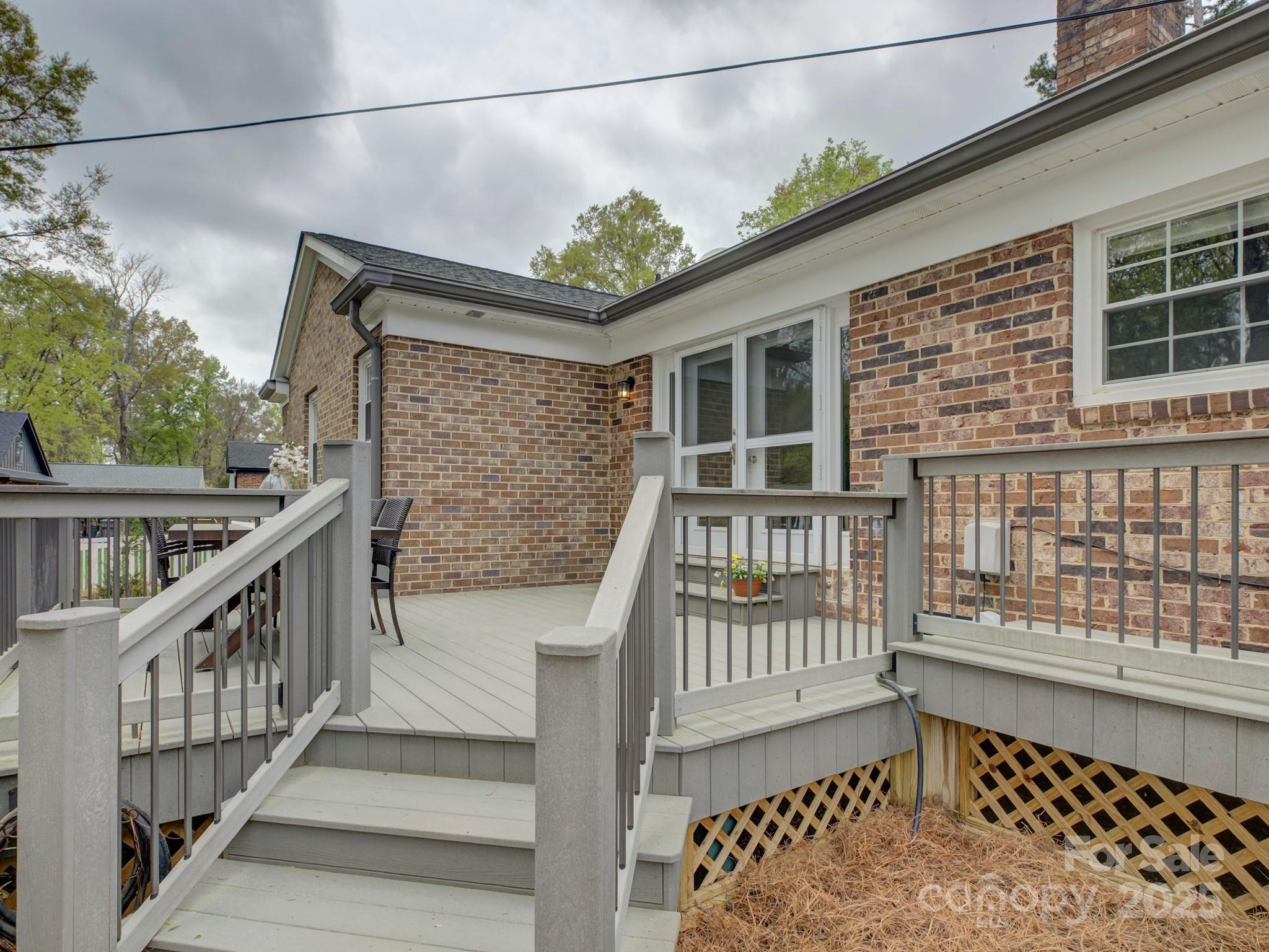 1340 Braeburn Road Charlotte, NC 28211 - Photo 42 of 46 a view of balcony with wooden floor and fence