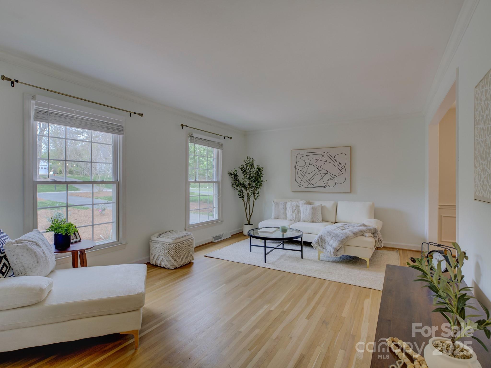 1340 Braeburn Road Charlotte, NC 28211 - Photo 6 of 46 a living room with furniture or couch and a potted plant