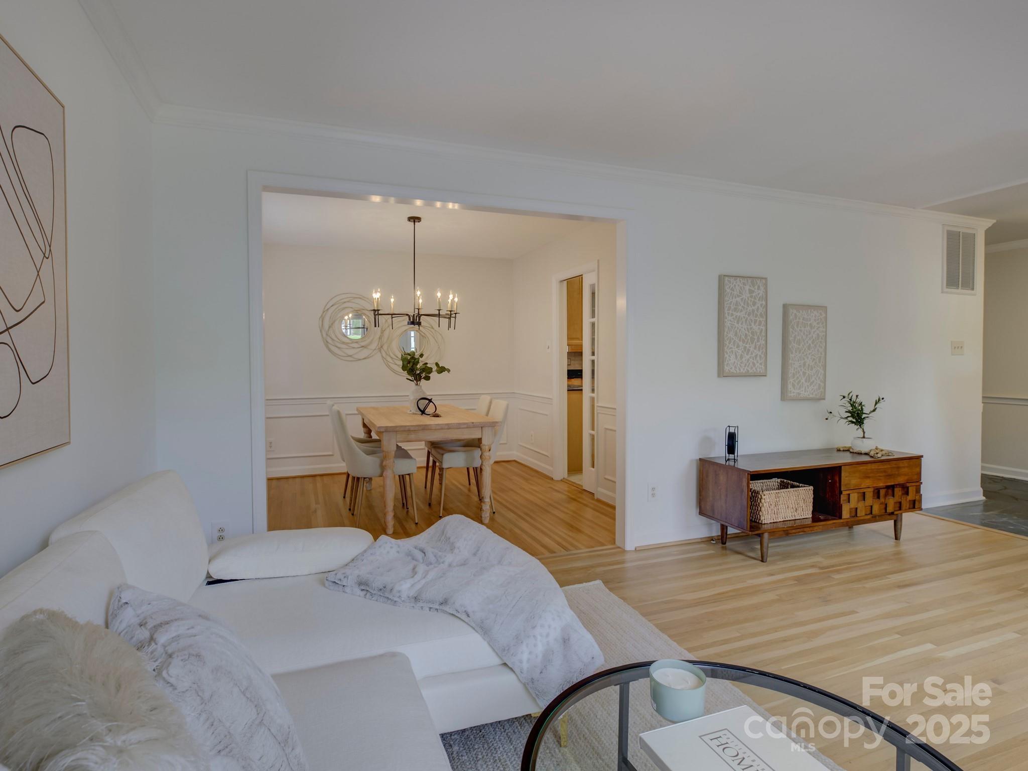 1340 Braeburn Road Charlotte, NC 28211 - Photo 8 of 46 a bedroom with a bed and a table chair