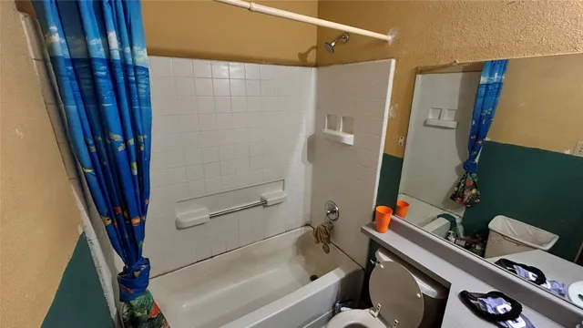 a bed room with two beds and a window