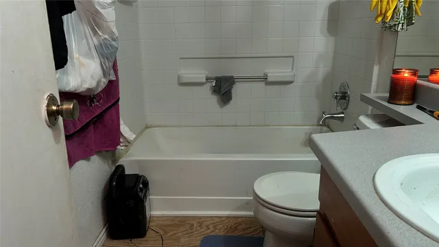 a bedroom with two beds and a window