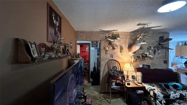 a view of a house with a yard covered in snow