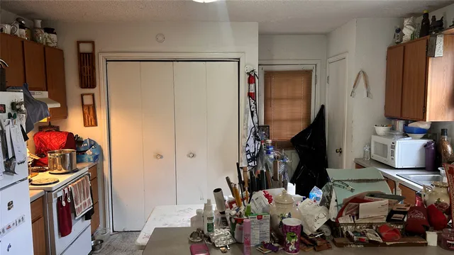 a bathroom with a sink a toilet and bathtub