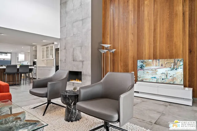 a view of a dining room with furniture and a large window