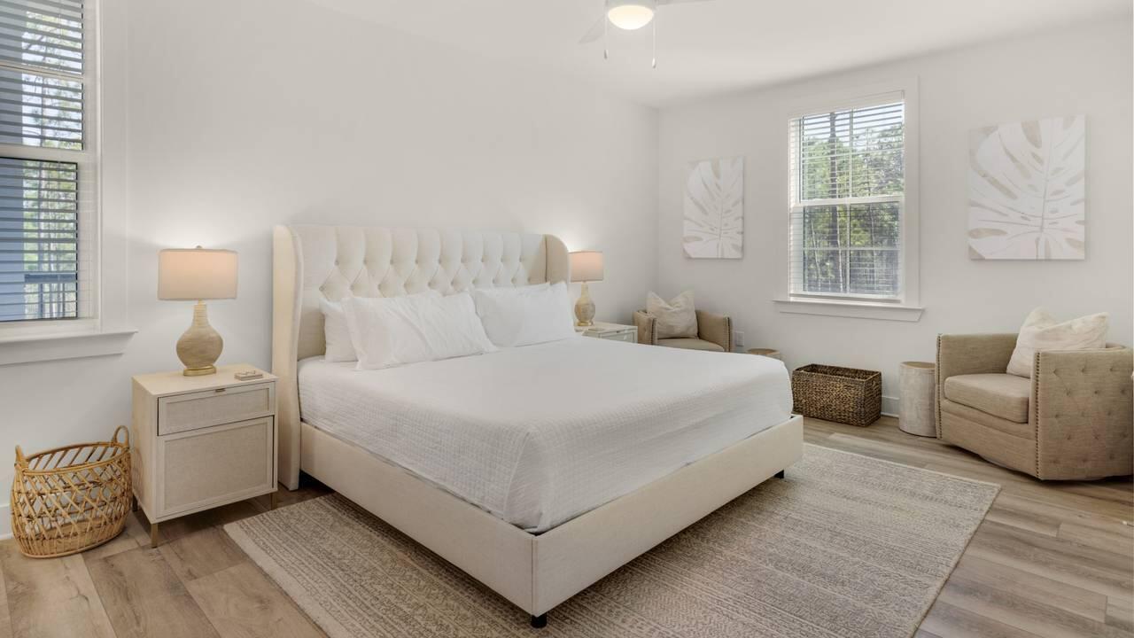 179 South County Highway 393, Unit 333 Santa Rosa Beach, FL 32459 - Photo 11 of 34 a bedroom with bed and a couch