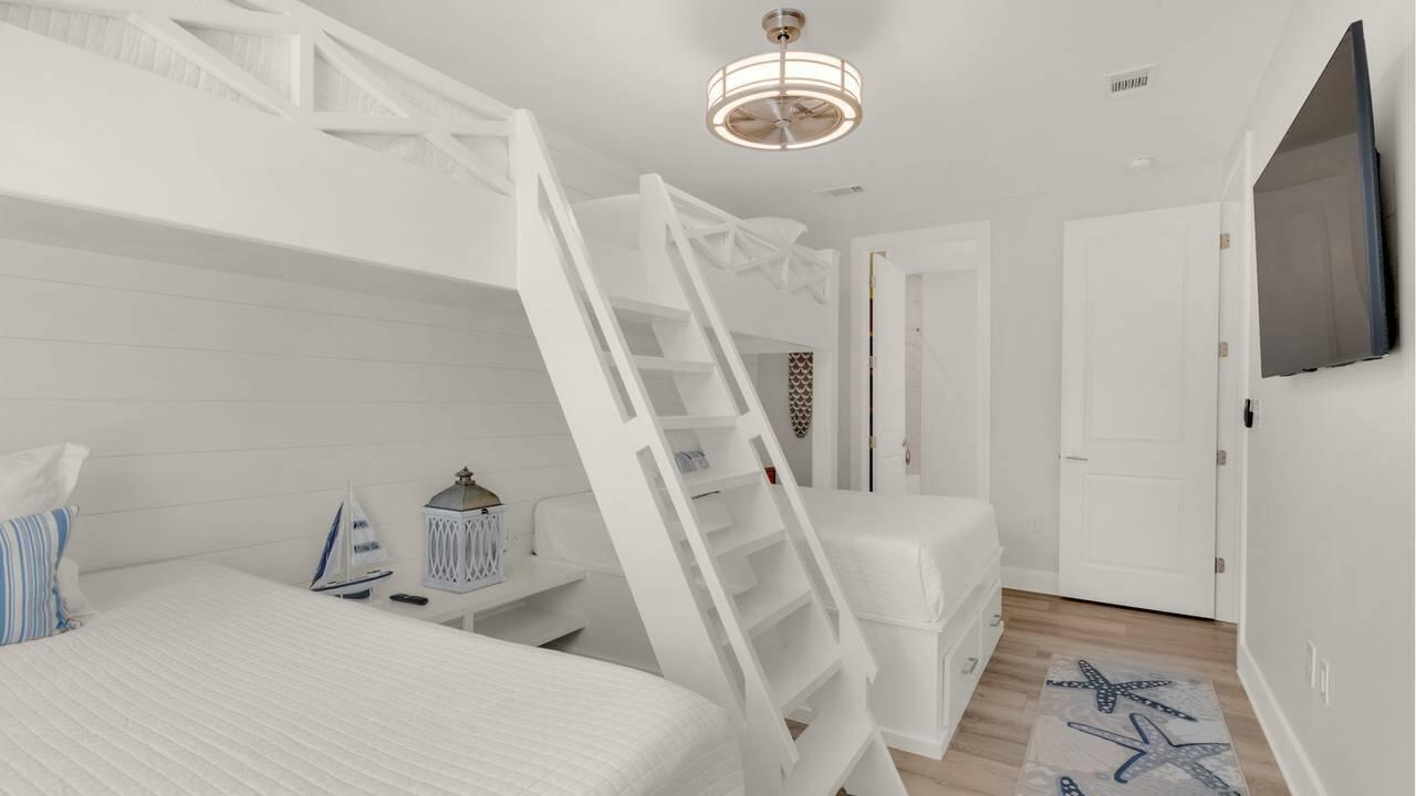 179 South County Highway 393, Unit 333 Santa Rosa Beach, FL 32459 - Photo 12 of 34 a bedroom with a bed and a flat screen tv