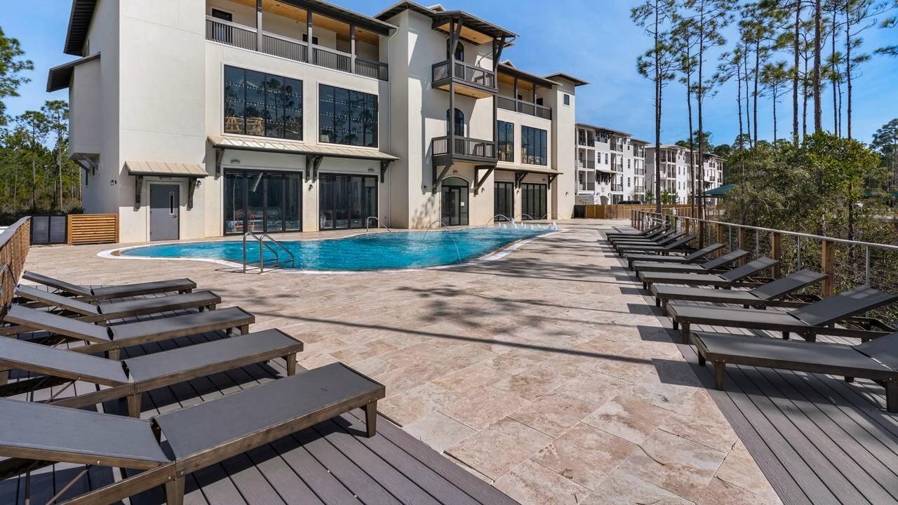 179 South County Highway 393, Unit 333 Santa Rosa Beach, FL 32459 - Photo 24 of 34 a view of a backyard with sitting area