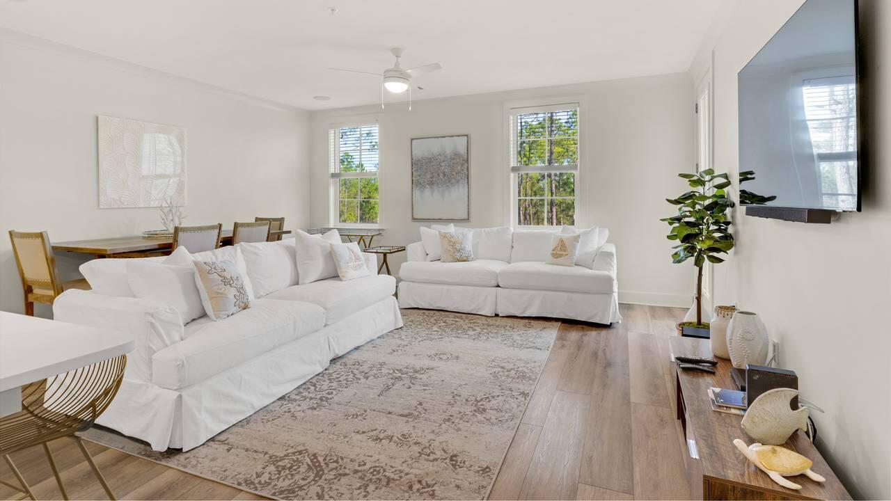 179 South County Highway 393, Unit 333 Santa Rosa Beach, FL 32459 - Photo 6 of 34 a living room with furniture and a potted plant