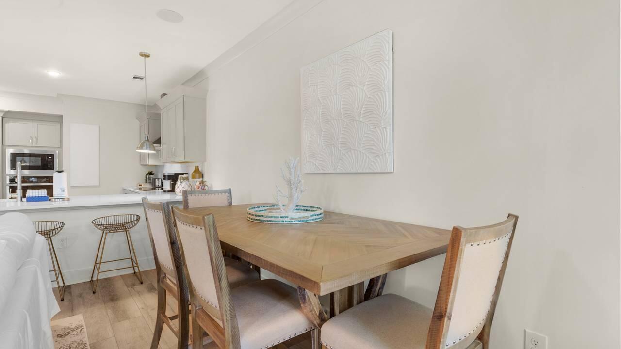 179 South County Highway 393, Unit 333 Santa Rosa Beach, FL 32459 - Photo 7 of 34 a view of a dining room with furniture