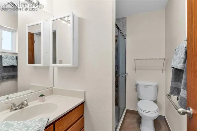 a bathroom with a shower and a curtain