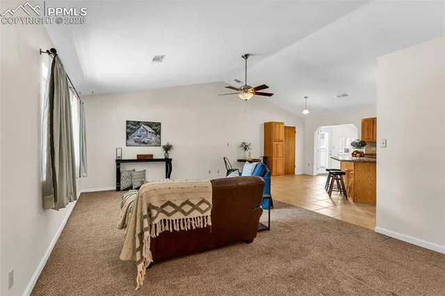 a bedroom with furniture and a chandelier