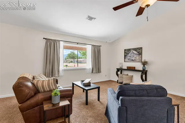 a living room with furniture and a window