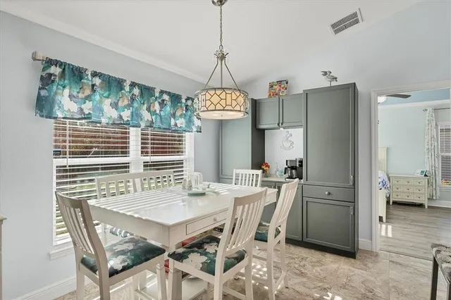 a bathroom with a granite countertop double vanity sink and a mirror