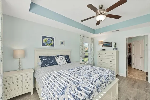 a bedroom with a large bed and a window