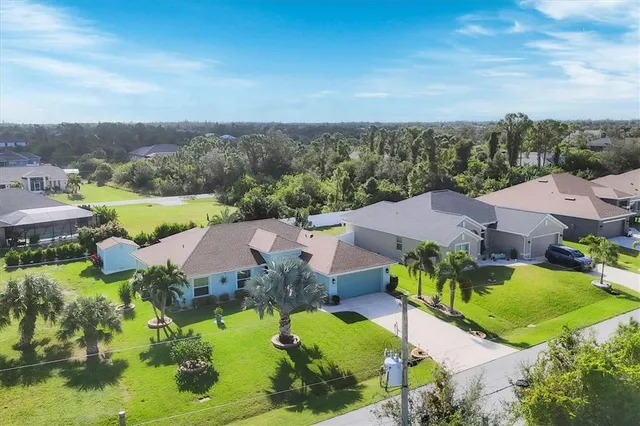 an aerial view of residential house with outdoor space