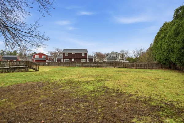 a view of a field with sitting area