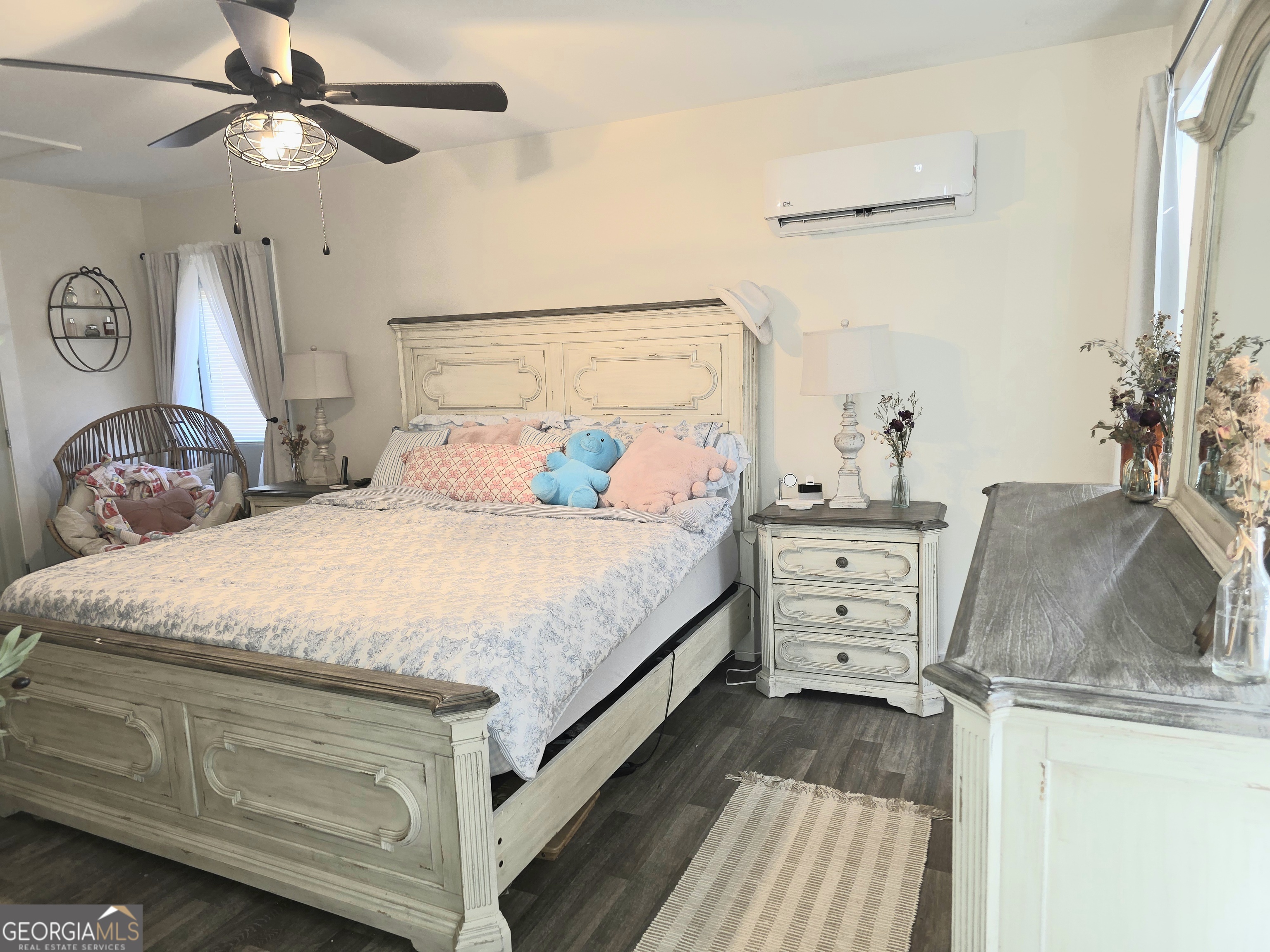 3060 Eatonton Road Madison, GA 30650 - Photo 46 of 65 a bedroom with a bed and wooden floor