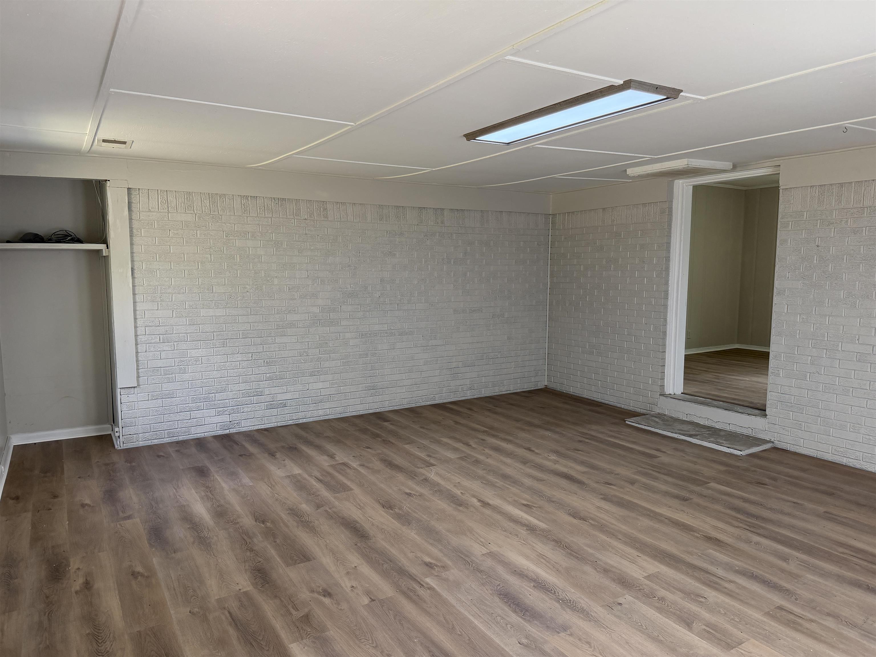 940 Old Lula Road Reagan, TN 38368 - Photo 15 of 39 a view of an empty room with wooden floor and a window
