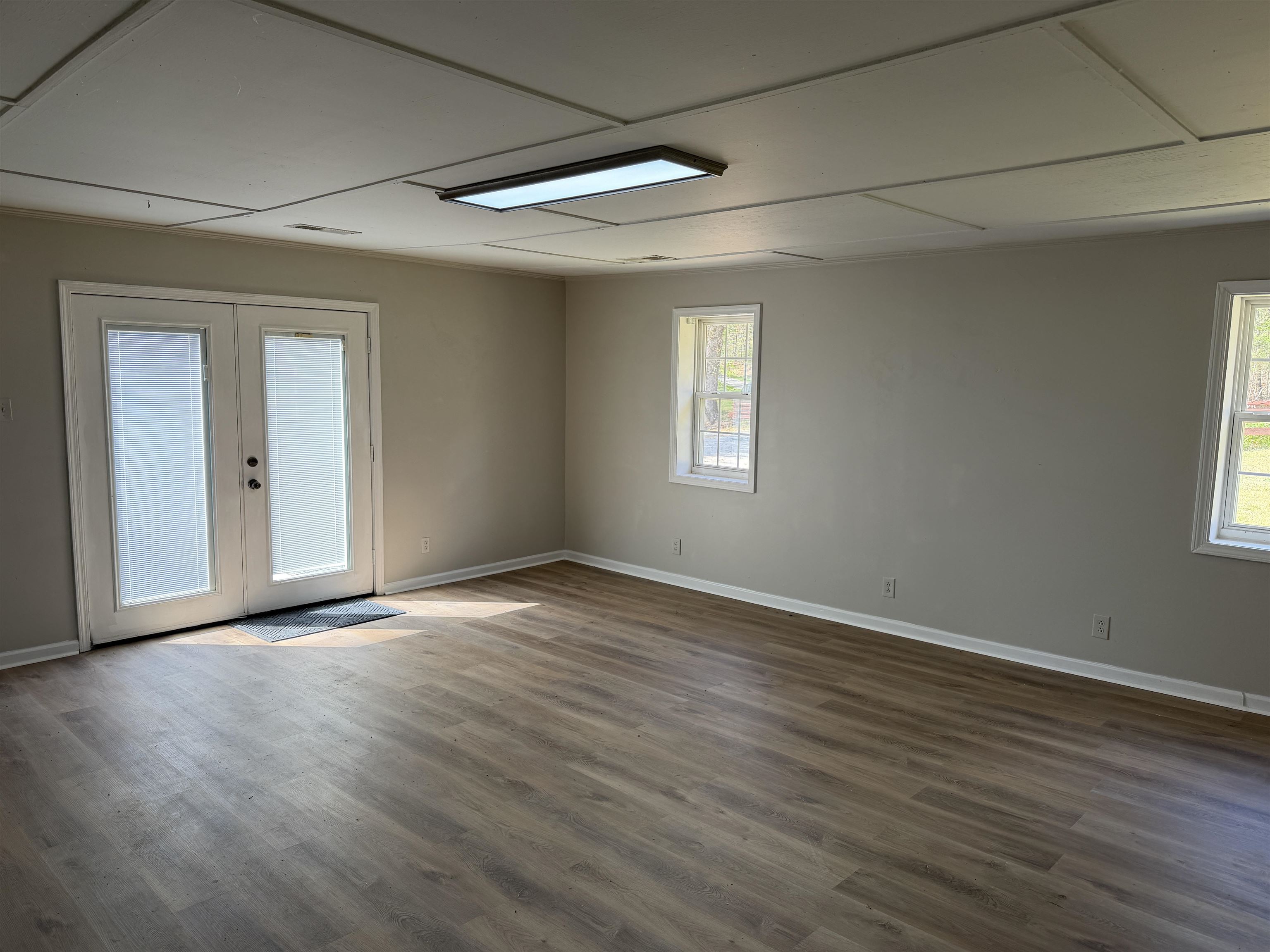 940 Old Lula Road Reagan, TN 38368 - Photo 16 of 39 a view of an empty room with wooden floor and a window