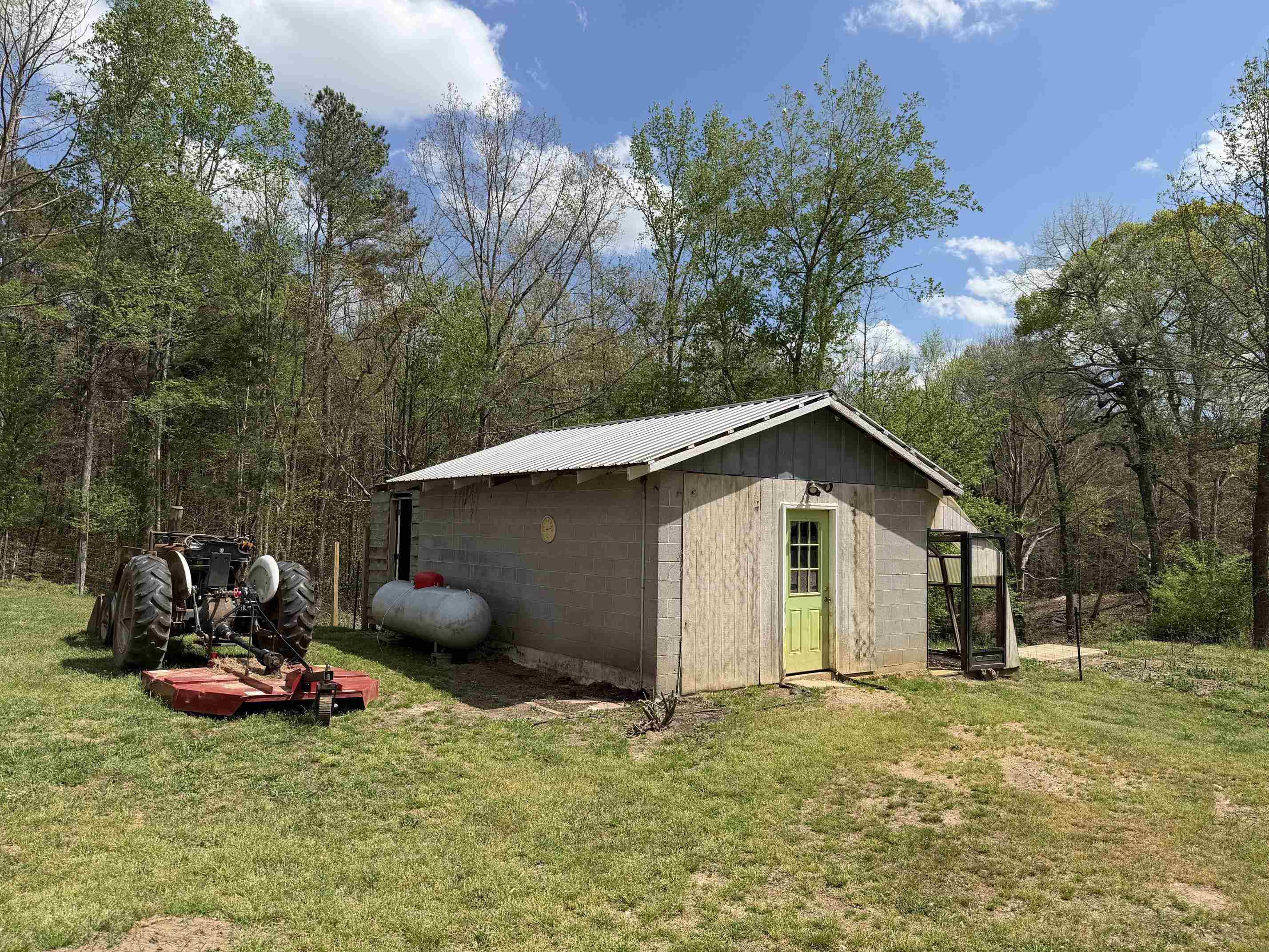 940 Old Lula Road Reagan, TN 38368 - Photo 23 of 39 a backyard of a house with table and chairs