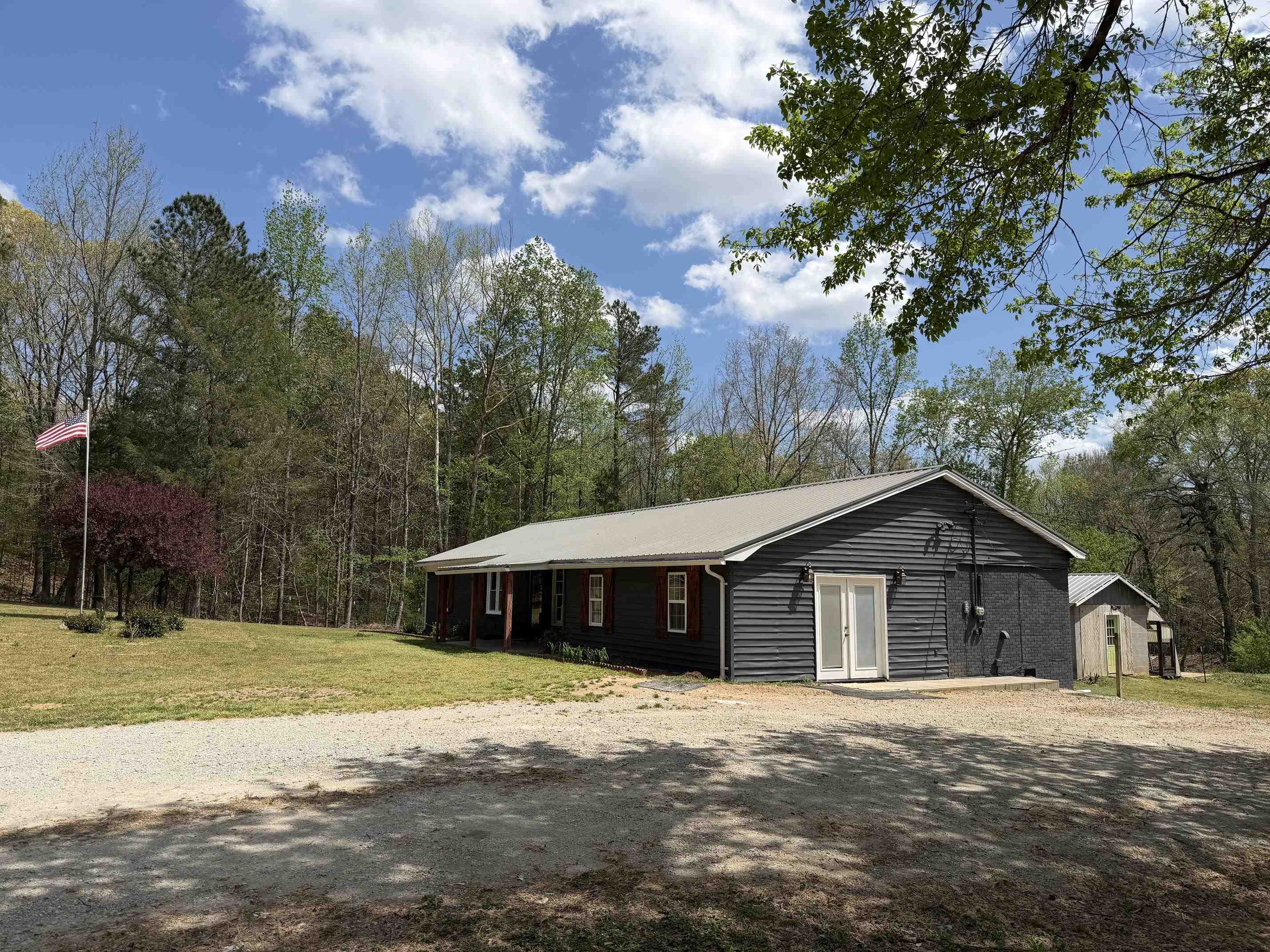 940 Old Lula Road Reagan, TN 38368 - Photo 25 of 39 a front view of a house with a yard and trees