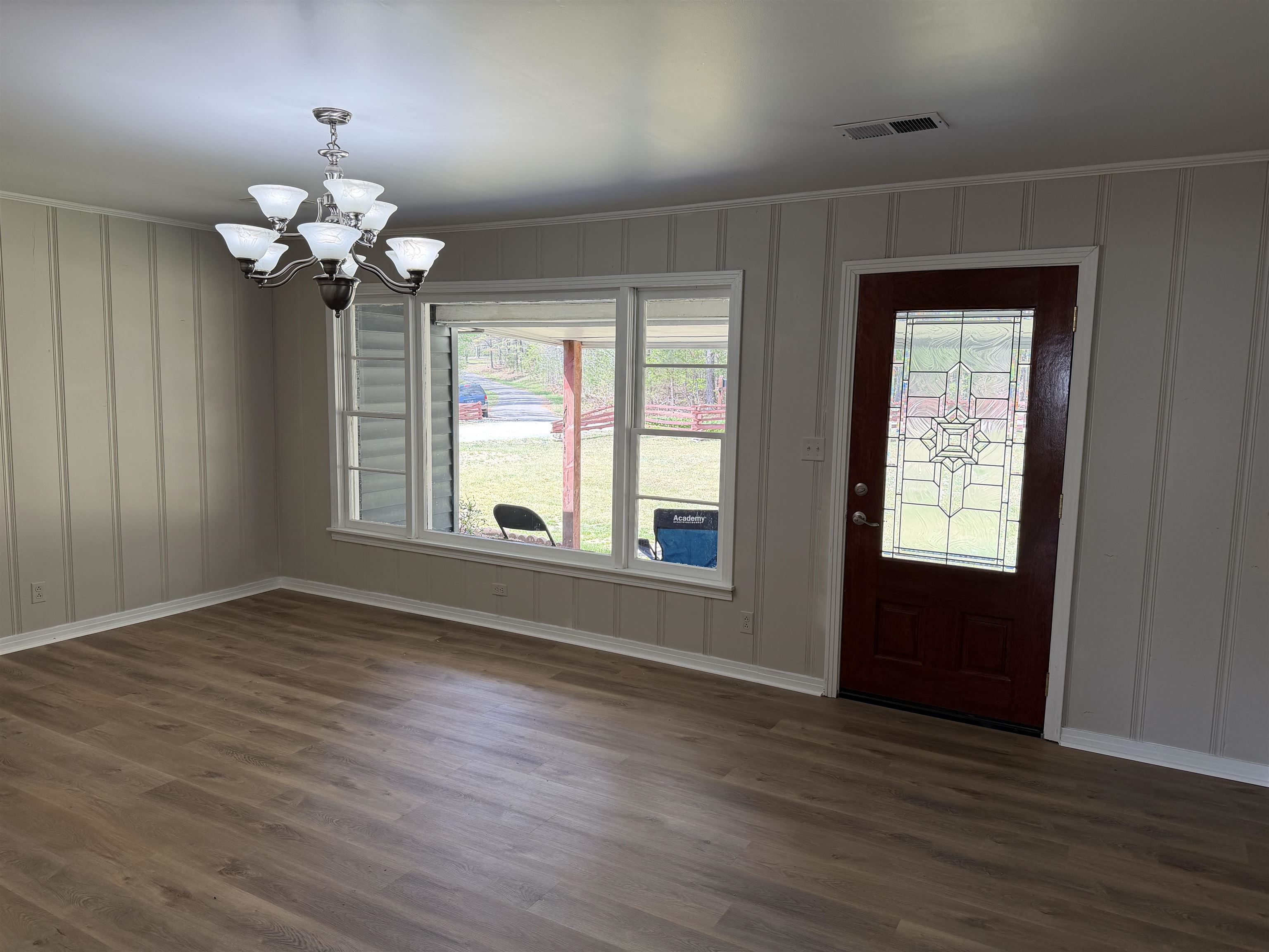 940 Old Lula Road Reagan, TN 38368 - Photo 9 of 39 a view of an empty room with a window and wooden floor