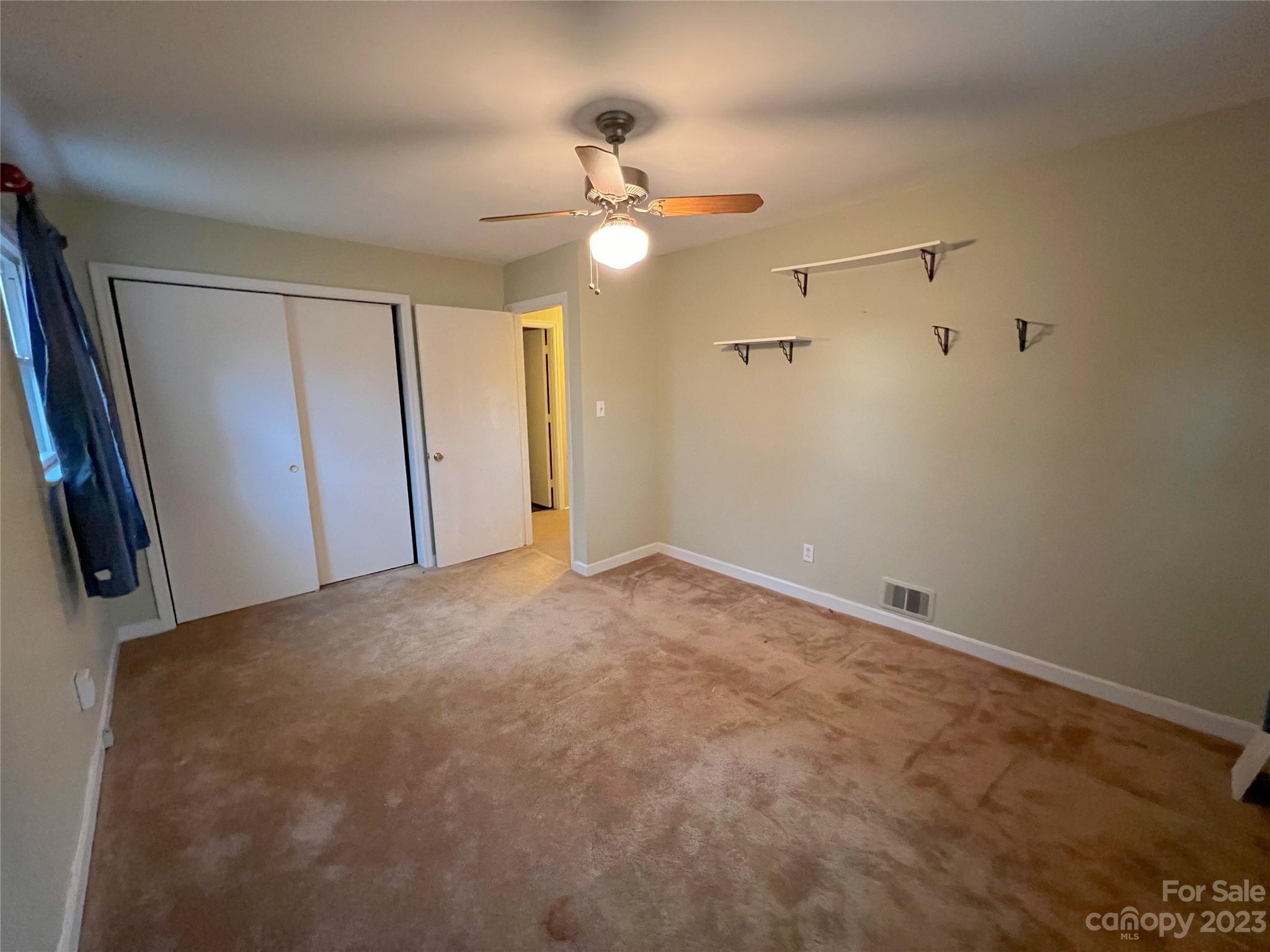 1265 Saluda Road Chester, SC 29706 - Photo 8 of 18 a view of an empty room with a chandelier fan