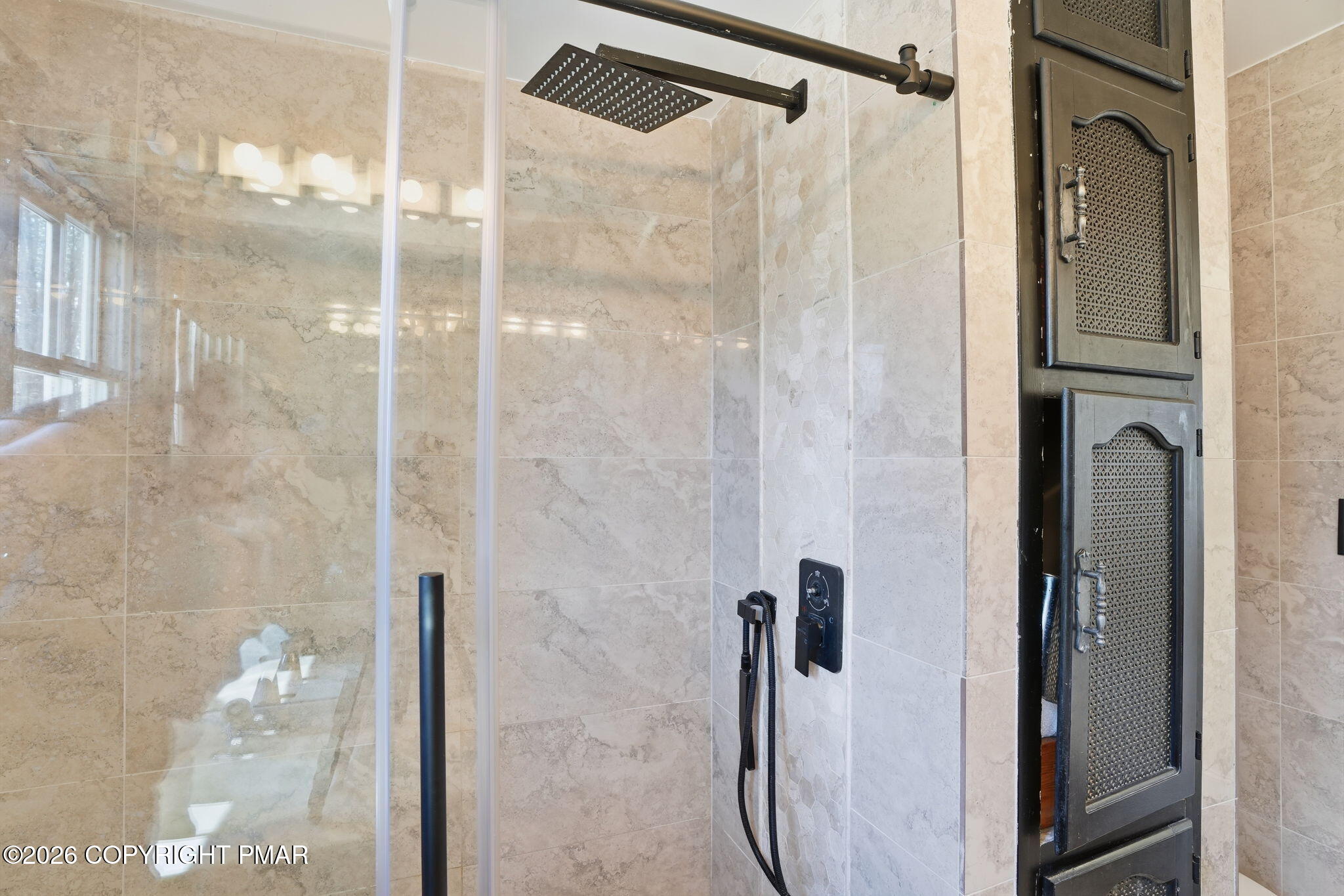 720 Stokes Mill Road East Stroudsburg, PA 18301 - Photo 27 of 87 a bathroom with a glass shower door and a sink