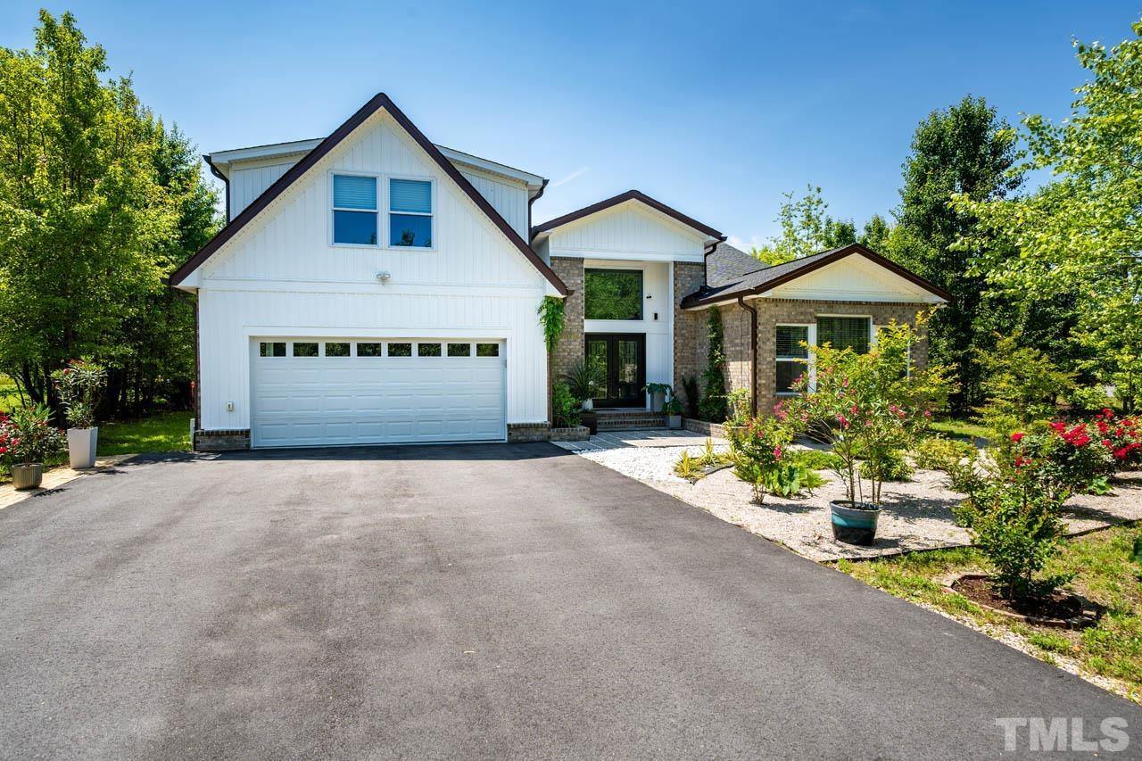 1028 Todd Road Knightdale, NC 27545 - Photo 1 of 48 a front view of a house with a yard and garage