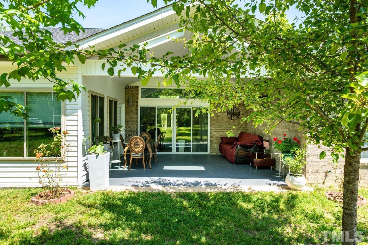 1028 Todd Road Knightdale, NC 27545 - Photo 12 of 48 a view of a house with backyard porch and sitting area