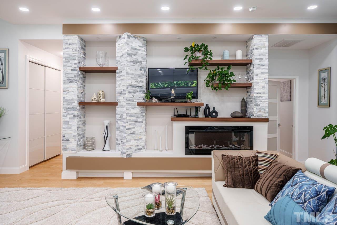1028 Todd Road Knightdale, NC 27545 - Photo 15 of 48 a living room with furniture and a fireplace