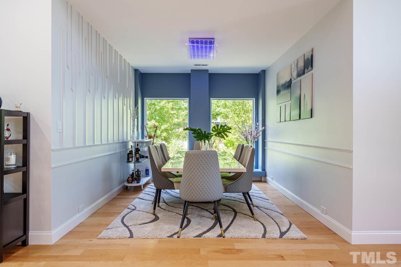 1028 Todd Road Knightdale, NC 27545 - Photo 16 of 48 a dining room with furniture window wooden floor